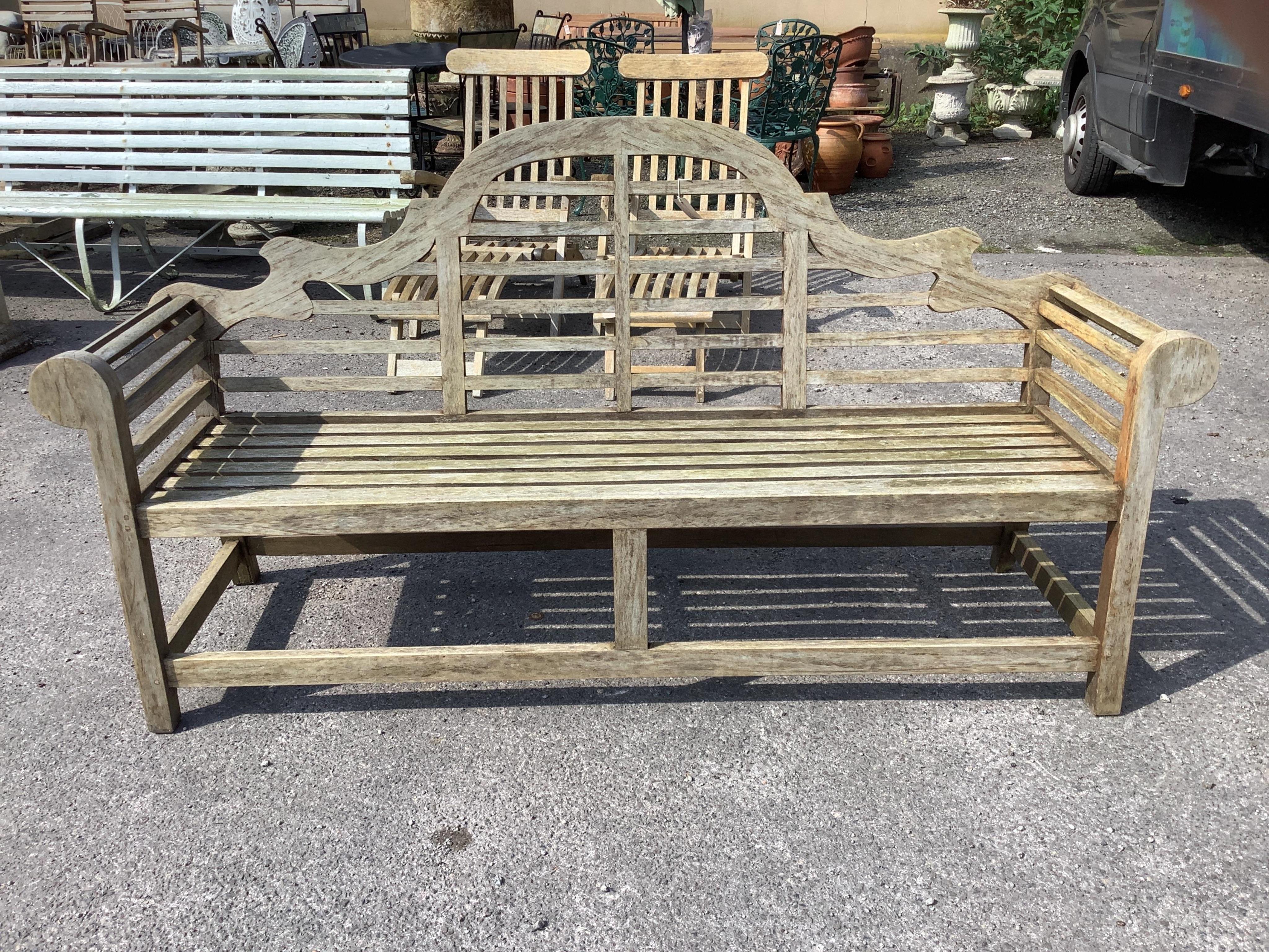 A weathered teak Lutyens style garden bench, width 196cm, depth 56cm, height 104cm